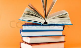 2329346-stack-of-books-on-the-color-background