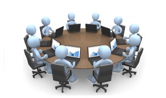 3d people sitting around a table using laptops .